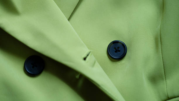 Green stylish suit with black buttons closeup Green stylish suit with black buttons closeup. coat wool button clothing stock pictures, royalty-free photos & images