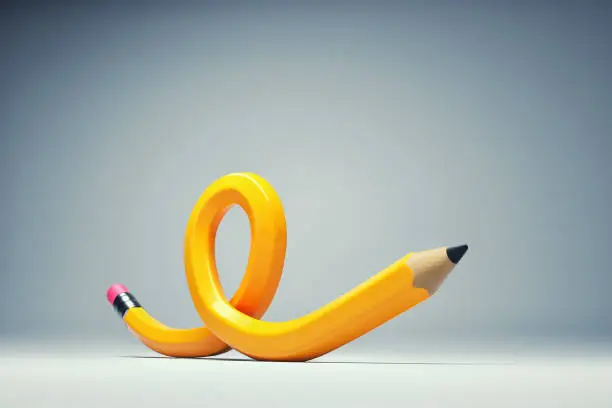 Photo of Twisted pen on background.