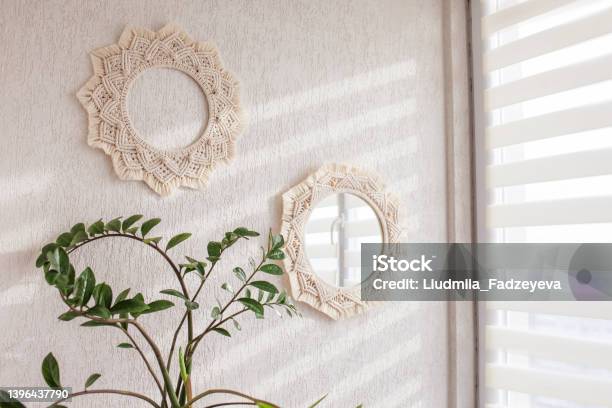 Macrame Mirror And Wreath On A White Wall Ecostyle Natural Materials Stock Photo - Download Image Now