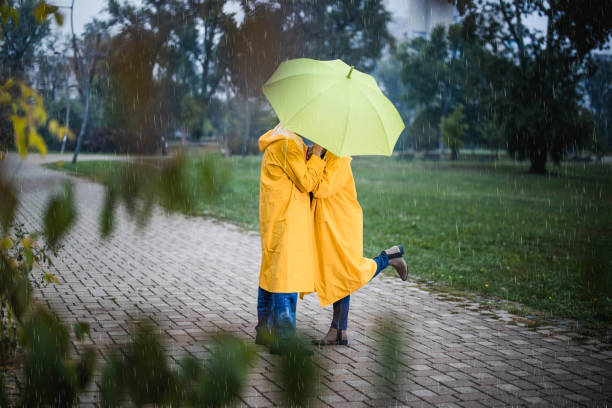 istock Kiss under the umbrella on rainy day! 1396439019