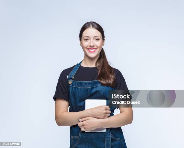 Happy Woman Standing With Digital Tablet Stock Photo - Download Image Now - Waiter, Cut Out, Portrait