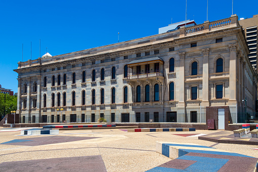 The seat of government for South Australia exiting into a paved town square
