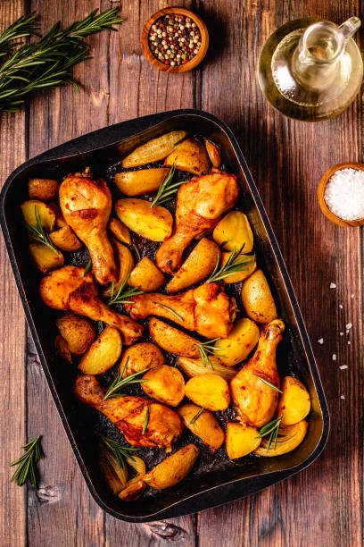 istock Roasted chicken legs with potatoes and rosemary. 1396440547