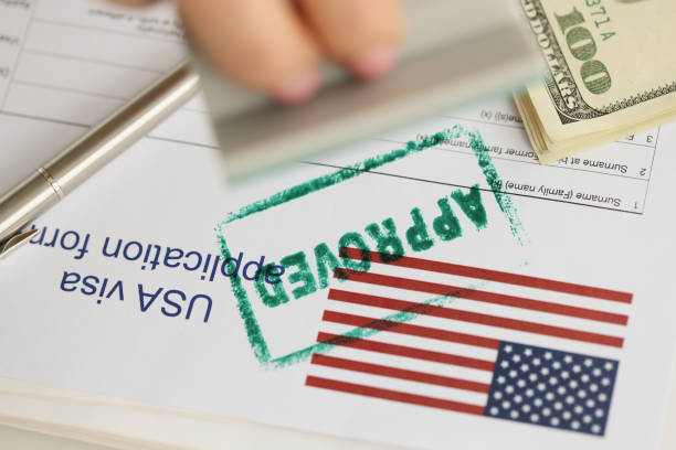 istock Green approved stamp on document, visa application form, hand stamping approved on sheet 1396441030