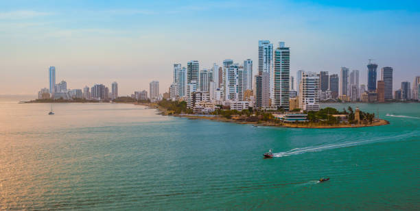 Skyline of Cartagena de Indias, Colombia. Bocagrande district. Modern skyscrapers along the coastline of Bocagrande district, close to the harbor of Cartagena, Colombia, South-America. Colorful image of the skyline at sunset. cartagena colombia stock pictures, royalty-free photos & images