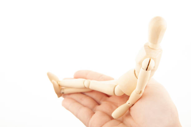 image of wooden mannequin hand white background studio