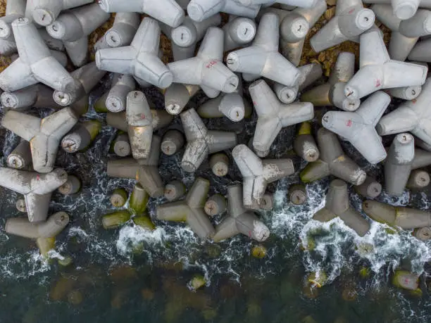 Aerial drone view of a new breakwater. breakwater in the sea, a collection of concrete breakers