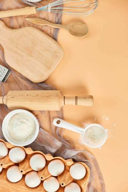 istock Bakery  or cooking frame, ingredients, kitchen items for pastry on pastel orange background. Top view, copy space. 1396444653