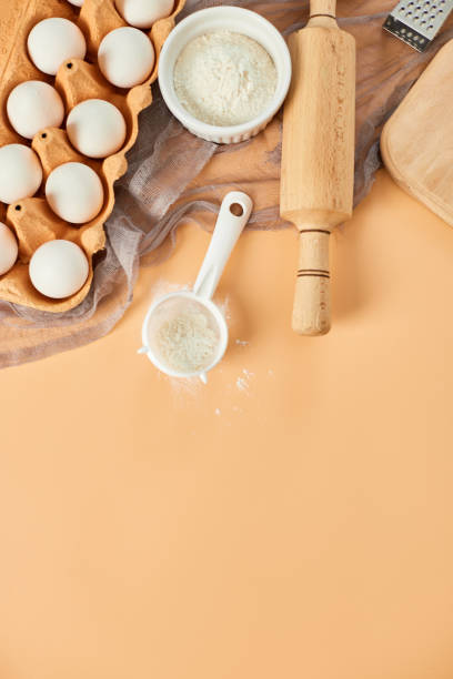 istock Bakery  or cooking frame, ingredients, kitchen items for pastry on pastel orange background. Top view, copy space. 1396444656
