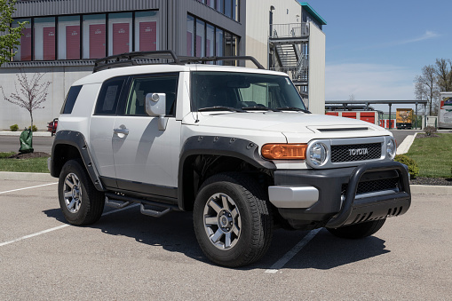Noblesville - Circa May 2022: Used Toyota FJ Cruiser display at a dealership. With current supply issues, Toyota is buying and selling many pre-owned cars to meet demand.
