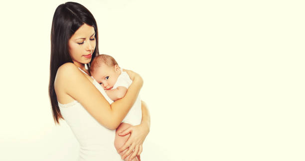 istock Baby sleeping on mother's hands on white background, blank copy space for advertising text 1396446146