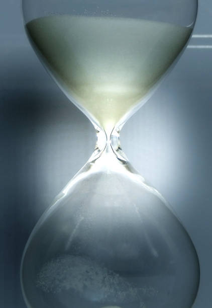 istock Sandglass Filled With Sand Closeup Photo 1396447816