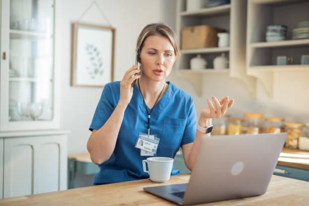 istock Female doctor meeting remotely working from home 1396448638