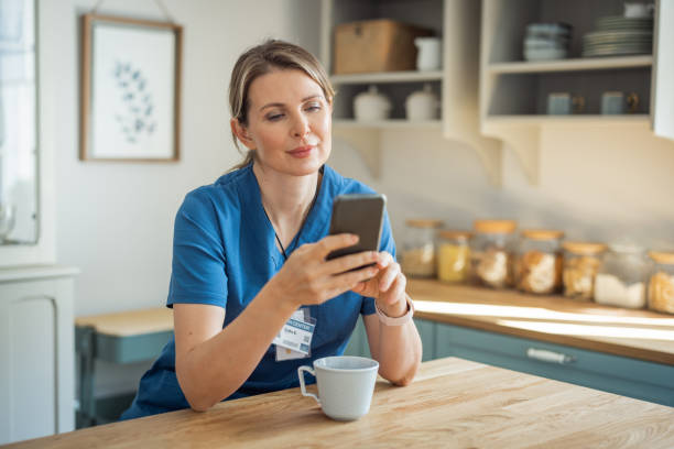 istock Female doctor at home 1396448703