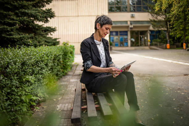 istock I use my break from work to surf the internet and sit in the park 1396448799