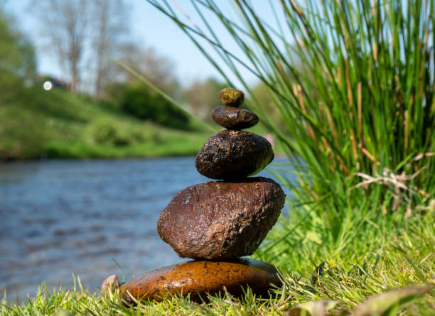 Balance stones on a river background