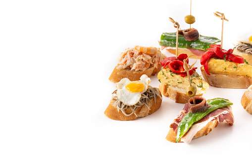 Assortment of Spanish pintxos isolated on white background