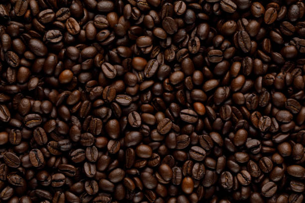 coffee grains seamless pattern - kavrulmuş kahve çekirdekleri stok fotoğraflar ve resimler