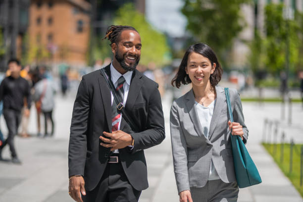 istock Multi-Ethnic Business Colleagues Walking In The City 1396456852