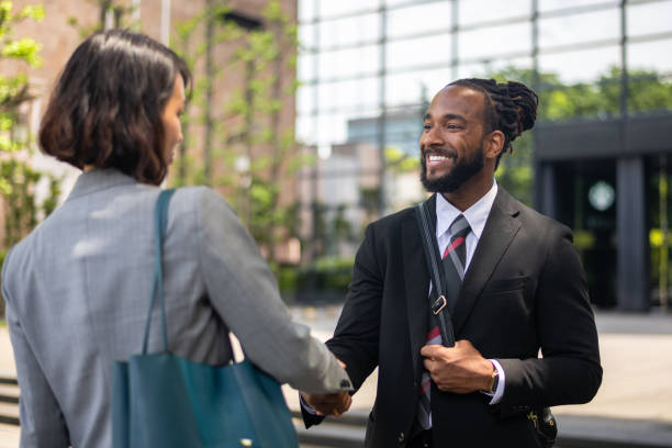 istock Corporate Lawyer And Coworker Meet And Greet Before A Networking Event 1396456882