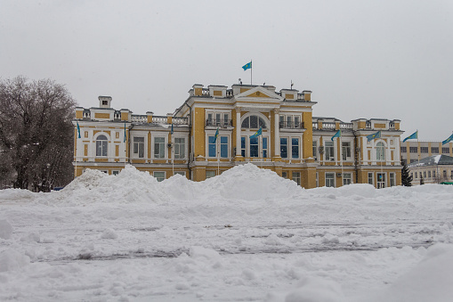 Uralsk, Kazakhstan (Qazaqstan), 11.03.2022 - A snowdrift in front of the building of the Akim's Office of the West Kazakhstan region in the city of Uralsk.