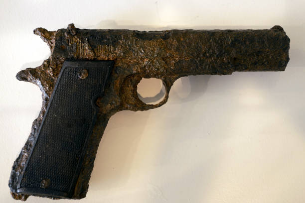 istock old rusted pistol being underwater for long time 1396458524