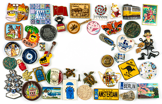 Souvenirs From Around The World On A White Background.