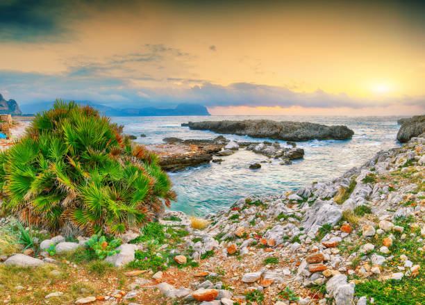 Gorgeous evening seascape of Isolidda Beach on San Vito cape. Popular travel destination of Mediterranean sea. Location: San Vito Lo Capo, Province of Trapani, Sicily, Italy, Europe