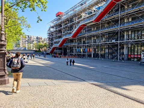 The Centre Pompidouwas designed in the style of high-tech architecture by the architectural team of Richard Rogers, Su Rogers, Renzo Piano and realized between 1971 and 1977. The Museum contains the Musée National d'Art Moderne, which is the largest museum for modern art in Europe. The image shows the museum during springtime.