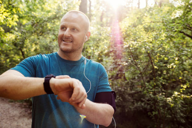 istock Man using Smart Watch measuring heart rate. 1396461526