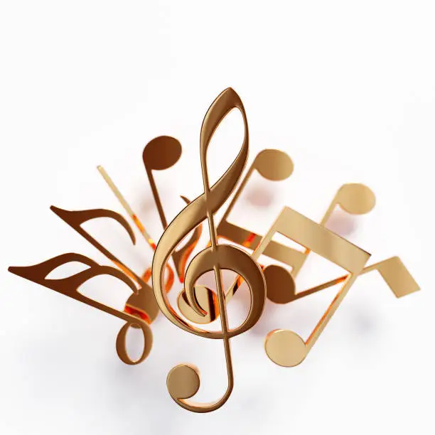 Realistic golden metal treble cle and   musical notes on a white background. 3d golden musical symbol - decoration elements for design.