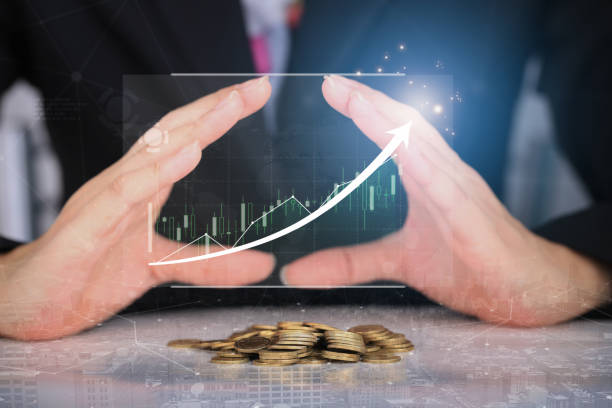 istock Hands saving money coins stack with growing business graph. Saving money concept. 1396463444