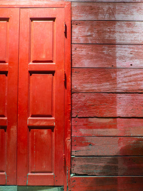 red wooden window.there are pale marks on the wall. - lock door horror gate imagens e fotografias de stock