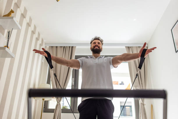 istock Young Caucasian man exercise on the pilates machine 1396467158