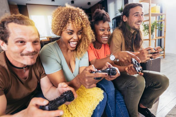 istock Group of friends playing video games. 1396467425