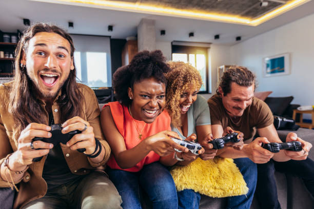 istock Group of friends playing video games. 1396467426
