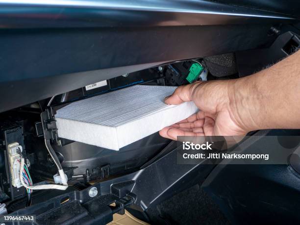 Replacement Air Filter For Car Hand Of The Car User For Maintenance Airconditioner Filter By Replacement Concept Diy Inside His Car Stock Photo - Download Image Now