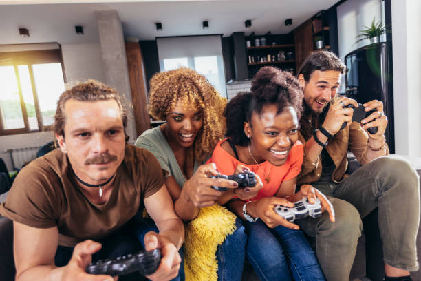 istock Group of friends playing video games. 1396467511