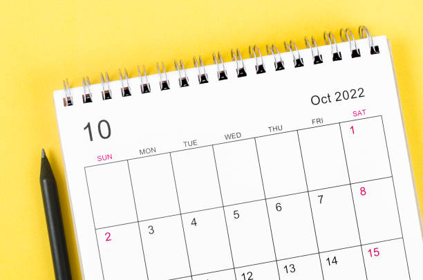 istock October 2022 desk calendar on yellow background. 1396469410