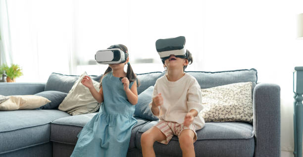 istock Asian child feeling excited while using 360 VR headset for virtual reality, Metaverse at home. 1396469861
