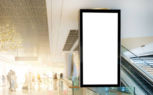 istock Billboard mock up inside department store. Template of an interior empty stand display, Mock-up of a shopping mall banner placeholder and poster. 1396473715