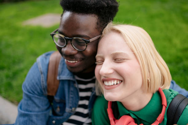 istock Happy diverse love couple hanging out on a sidewalk 1396475063