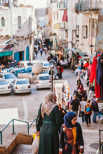 Bethlehem, West Bank, Palestinian Territories - May 3rd, 2022: Palestinians walking and doing daily routines at street in bethlehem, which is the capital city of Palestine.