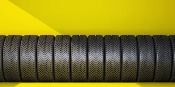 istock row of car tires on yellow background 1396477261