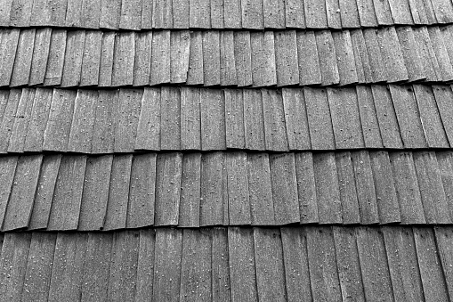 Closeup grey roof tiles, background with copy space, full frame horizontal composition