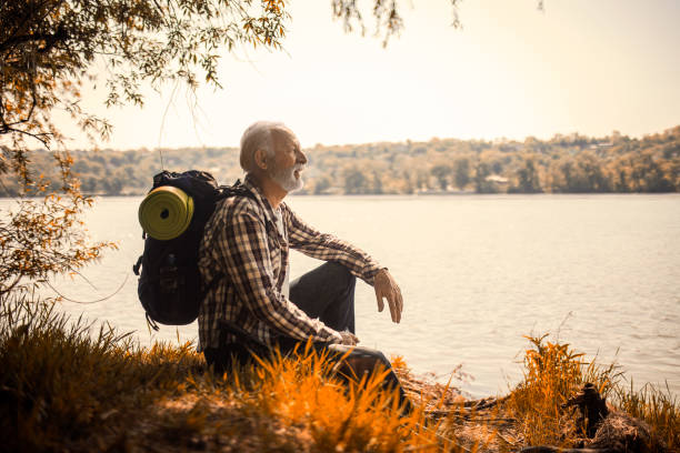 istock Mature hiker with backpack enjoying sunset 1396480191