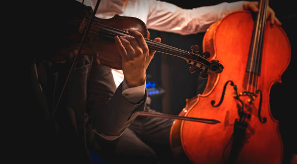 istock Musicians play violins and cellos at a concert 1396480602