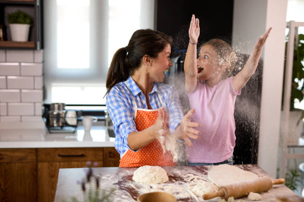 istock Happy family in the kitchen making cookies 1396480692