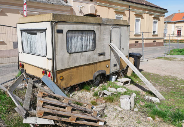 istock Old ruined caravan at the construction site 1396480765