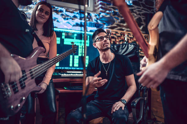 istock Band Working On New Song With Producer 1396484602